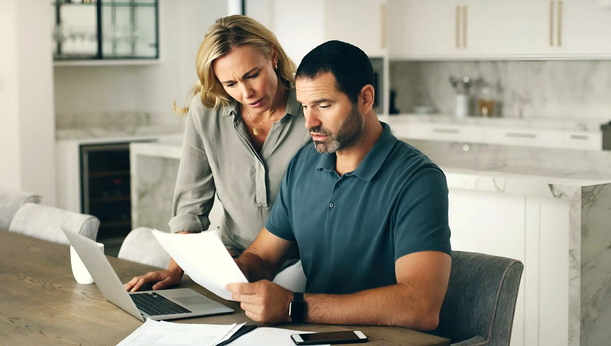new york homeowners couple reviewing their central hudson electric bill