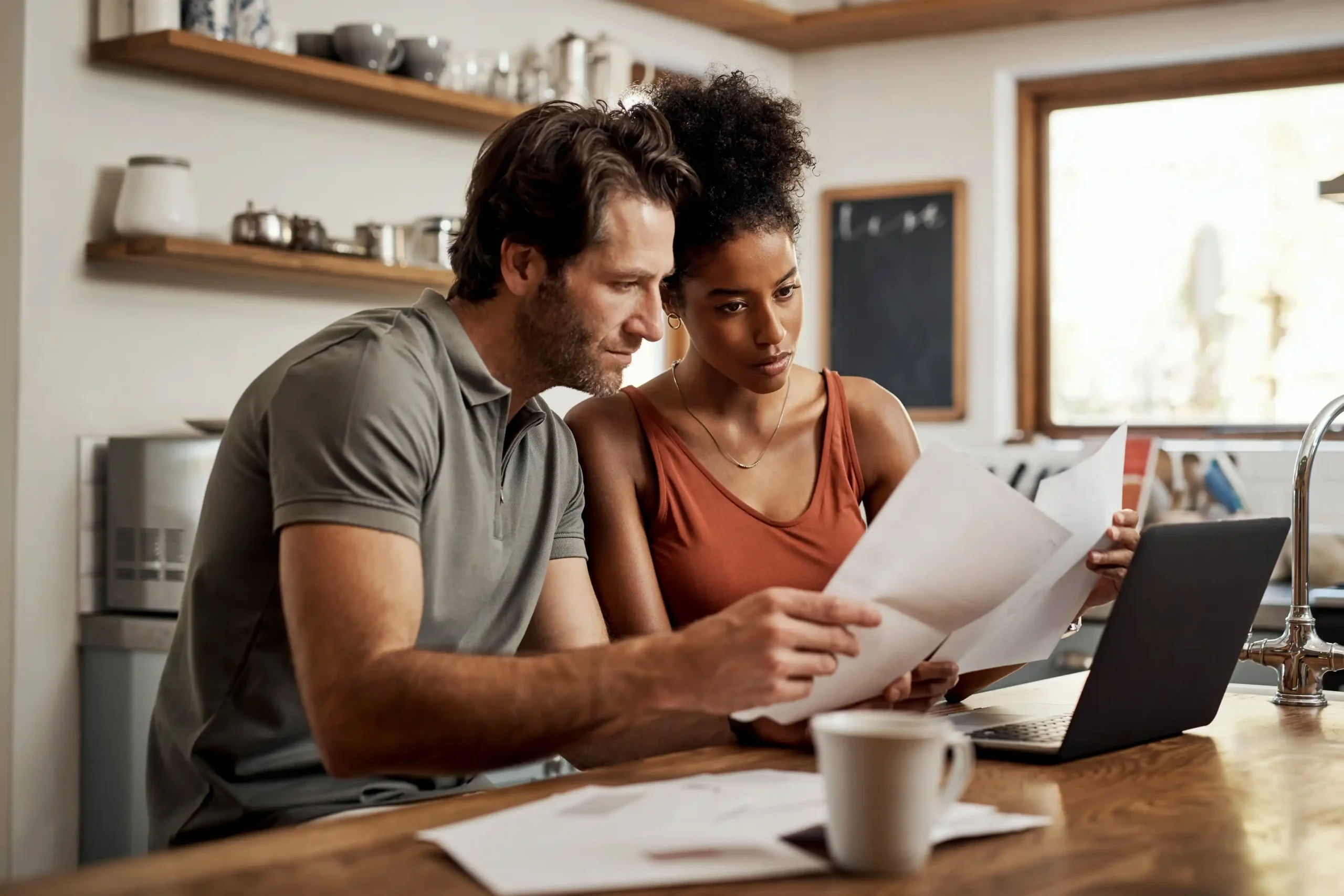 a couple learning solar quotes at the kitchen table