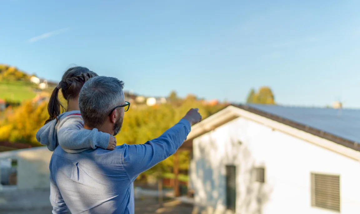 father showing daughter a home with solar panels in ny