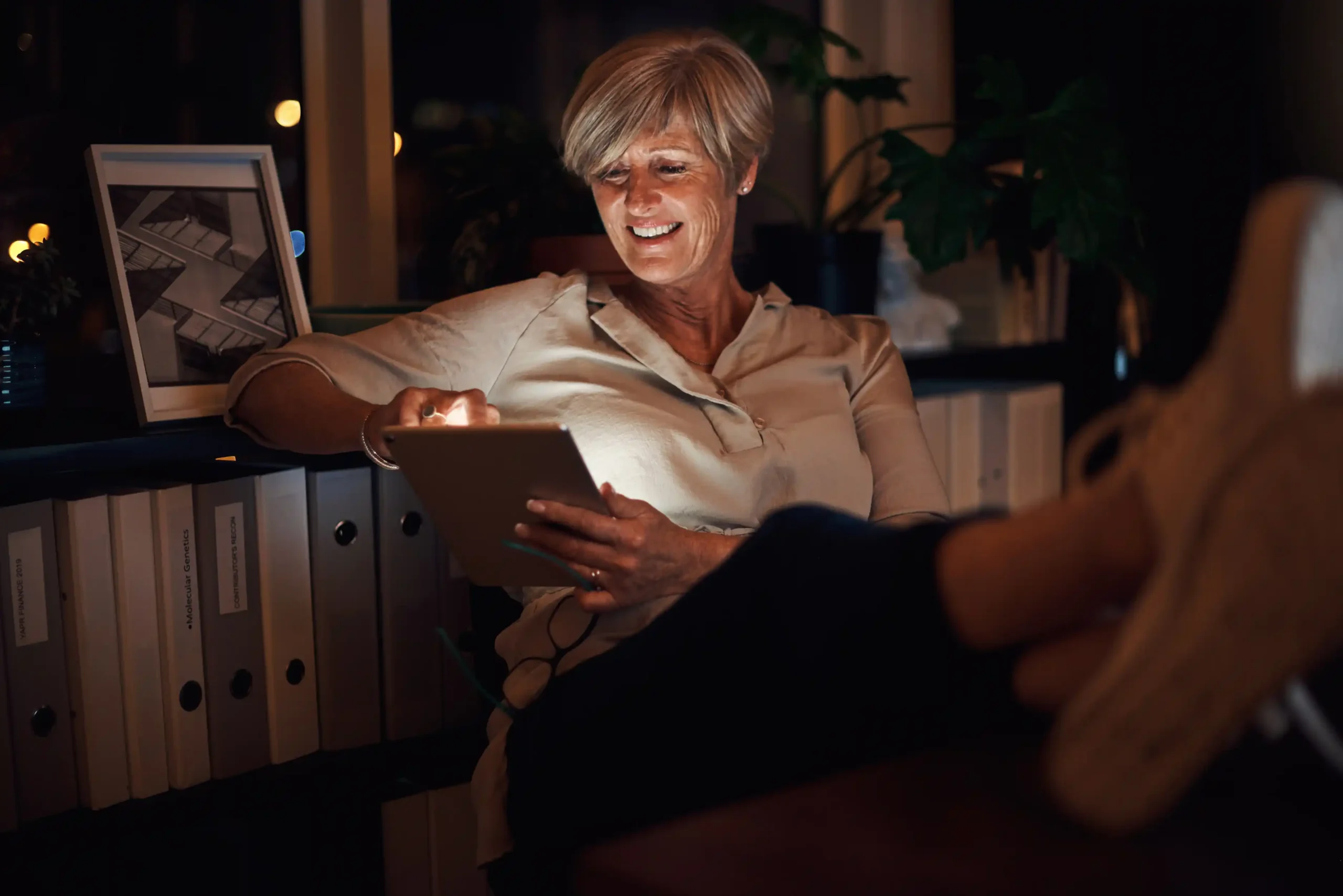 female homeowner looking learning about incentives and smiling