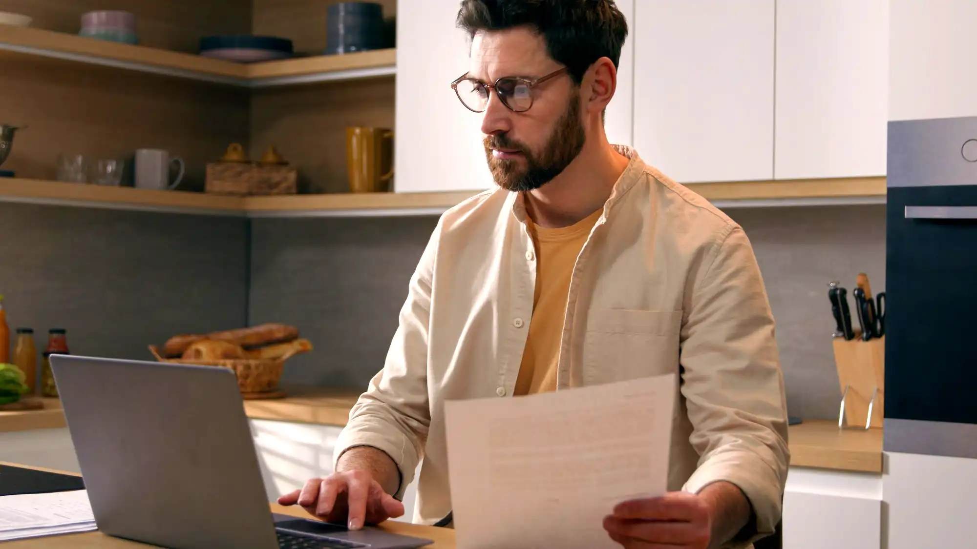 homewoner looking at his national grid electric bill